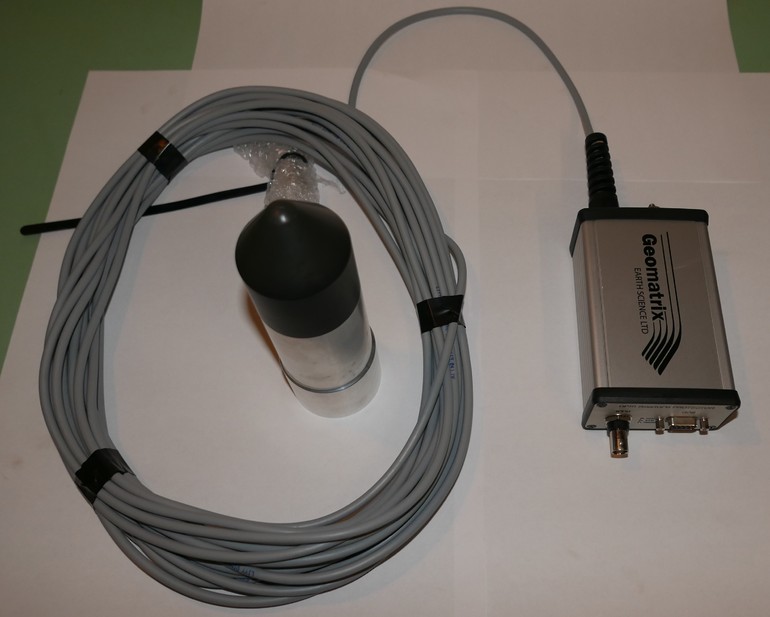 Fig.1. Image of the SmartGPS-3TP and the Geomatrix GP111 Smart GPS protecto, connected via the 200m cable.