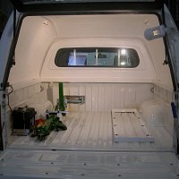 Rear of logging vehicle with integrated winch and probe rack.