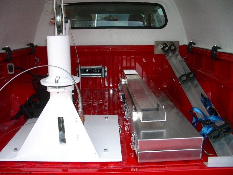 Integrated Mount Sopris Borehole Logging system with adjustable boom, winch, probe storage and work station.